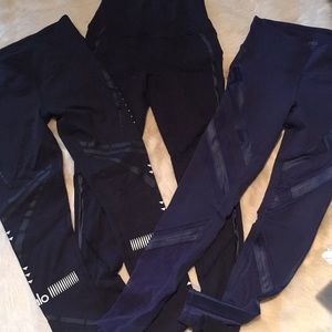3 pair of Alo leggings 2 black, 1 navy